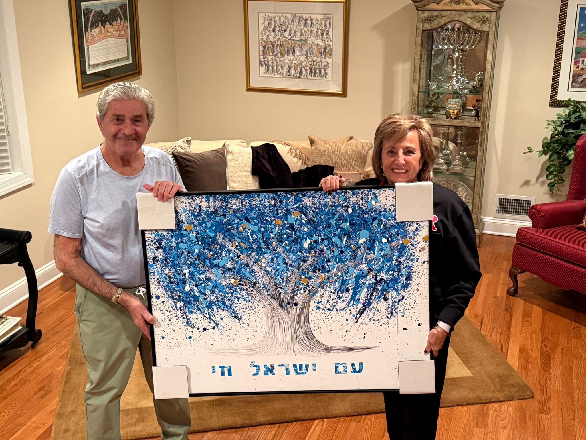 Happy collectors with their Tree of Life painting